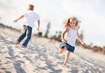 Image showing Adorable Brother and Sister Having Fun at the Beach