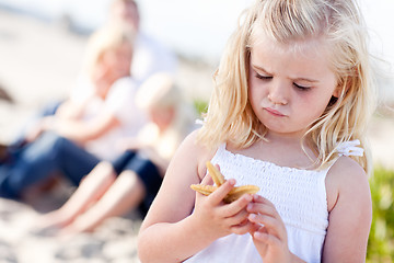 Image showing Adorable Little Blonde Girl with Starfish