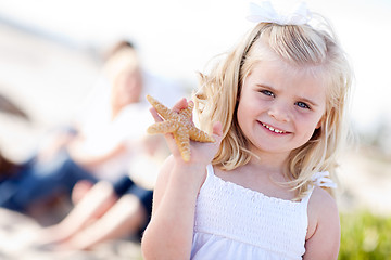 Image showing Adorable Little Blonde Girl with Starfish