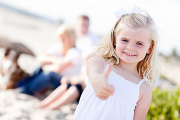 Image showing Adorable Little Blonde Girl with Thumbs Up At the Beach