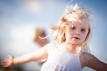 Image showing Adorable Blue Eyed Girl Playing Outside