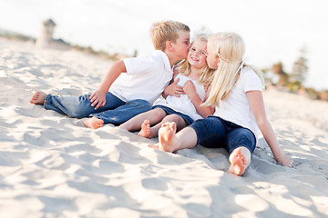 Image showing Adorable Sibling Children Kissing the Youngest