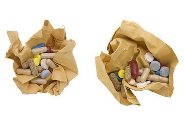 Image showing colored pills and crumpled paper 