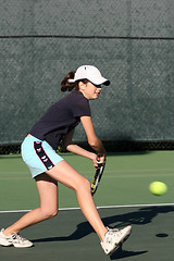 Image showing Young girl playing tennis