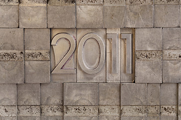 Image showing 2011 - metal printing blocks background