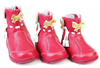 Image showing Red leather baby boots