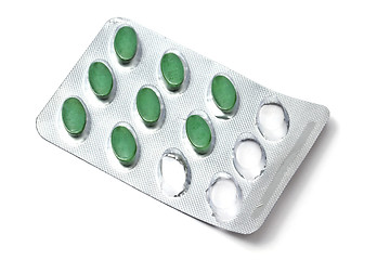 Image showing green pills isolated on white 