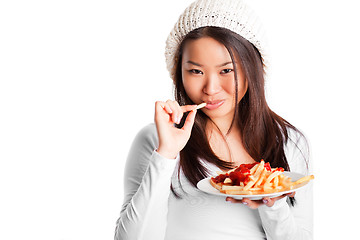 Image showing Eating french fries