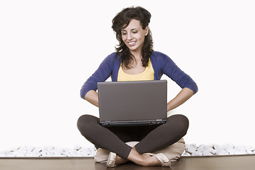 Image showing relaxed woman working on notebook