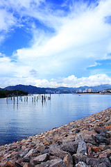 Image showing Blue lake idill under cloudline sky 