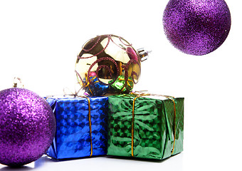 Image showing Christmas gift box with christmas balls on white