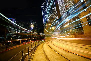 Image showing light trails on the modern building background