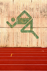 Image showing running track and a logo on the wall 