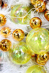 Image showing Christmas balls on white feathers