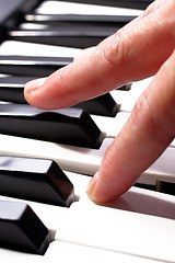 Image showing hands playing music on the piano, hands and piano player, keyboa