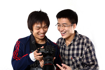 Image showing two asian man watching the photo in camera