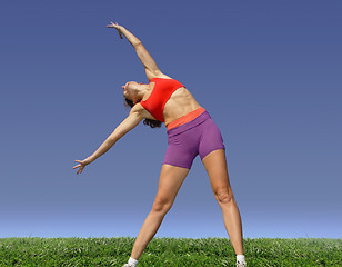 Image showing Girl exercising outdoors