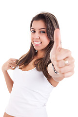 Image showing pretty girl with thumb raised as a sign of success,