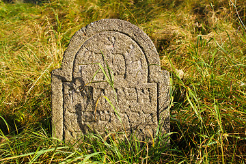 Image showing detail of tomb on forgotten and unkempt Jewish cemetery with the strangers