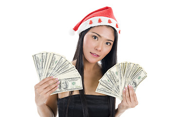 Image showing woman with santa claus hat and money