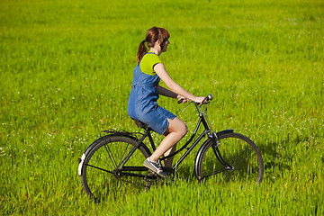 Image showing Riding a bicycle