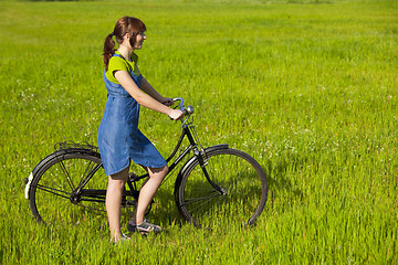 Image showing Girl with a bicycle