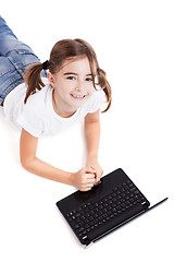 Image showing Little student girl with a laptop