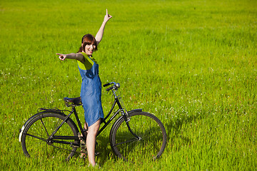 Image showing Girl with a bicycle