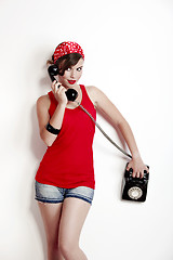 Image showing Girl with a vintage phone