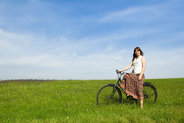 Image showing Girl with a bicycle