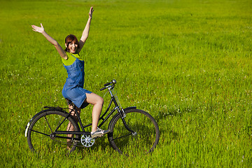 Image showing Girl with a bicycle