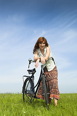 Image showing Girl with a bicycle