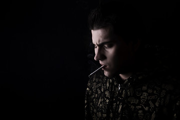 Image showing portrait of a young man with cigarette  