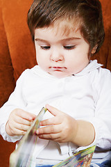 Image showing Cute baby girl with book