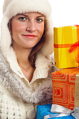 Image showing Portrait of the young woman with New Year's gifts, it is isolate