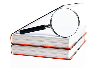 Image showing Two books and magnifier, it is isolated on white