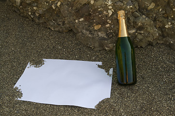 Image showing Blank postcard and champagne bottle