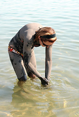 Image showing Washing off Dead Sea Mud