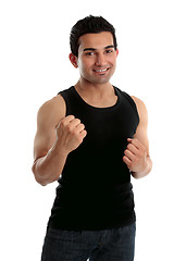 Image showing Adult male holding up two fists and smiling