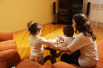 Image showing Mother playing with daughters at home