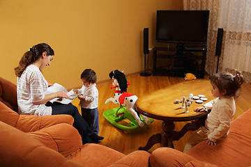 Image showing Mother with daughters at home