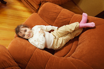 Image showing Smiling girl in big chair