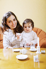 Image showing Smiling mother playing with daughter