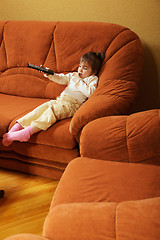 Image showing Child with remote control sideview