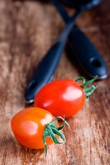 Image showing fresh tomatoes and kitchen utensil 