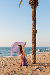 Image showing Oriental dancer performing on a beach