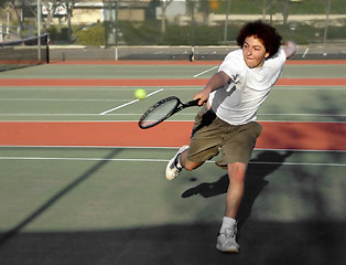 Image showing Teenage boy playing tennis