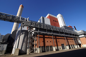 Image showing Modern industrial factory against blue sky