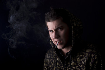 Image showing portrait of a young man with cigarette  