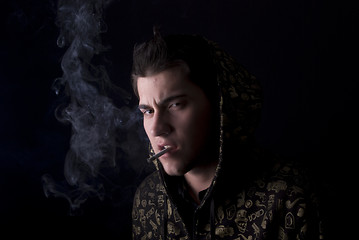 Image showing portrait of a young man with cigarette  